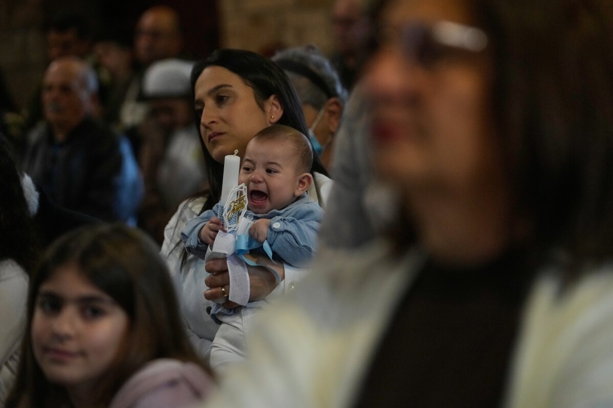 Photos show Lebanon’s Catholics marking Palm Sunday as the shadow of war weighs heavily