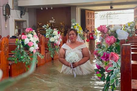 Catholic Couple Braves Cold Waters on Wedding Day Amid Monsoon