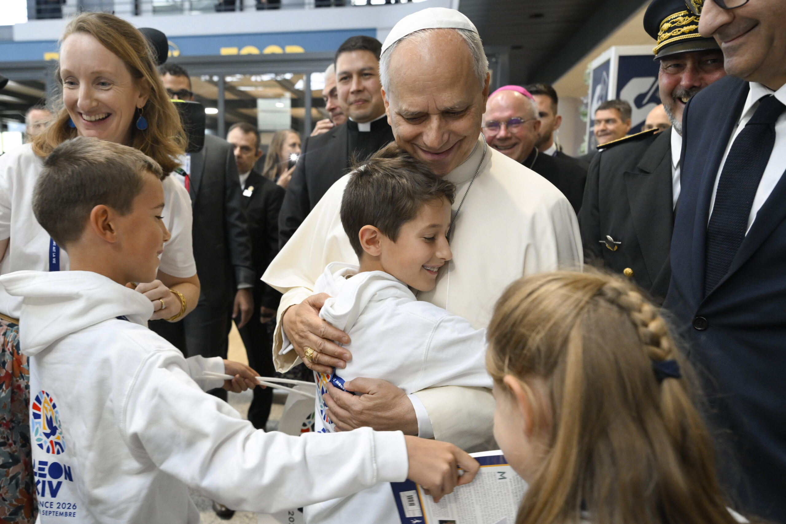 Pope Leo XIV embraces a child after landing in Metz, France, on Sept. 28, 2026. | Credit: Vatican Media
