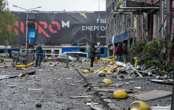 People look at damaged office center after a Russian missile attack in central Kyiv, Ukraine, Monday, Oct. 19, 2026. (Credit: Efrem Lukatsky/AP.)